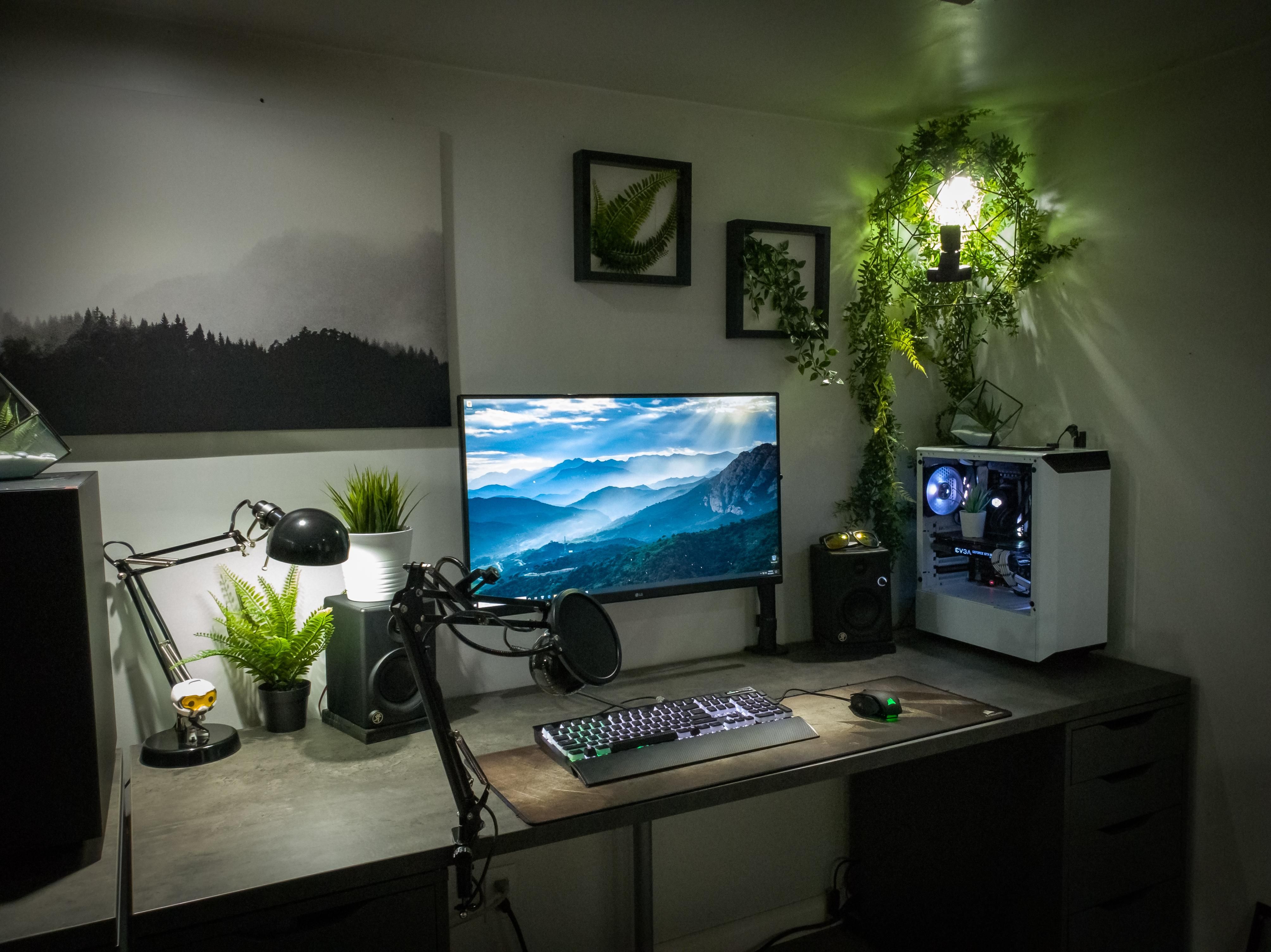 Vibrant gaming desktop setup with green background glow
